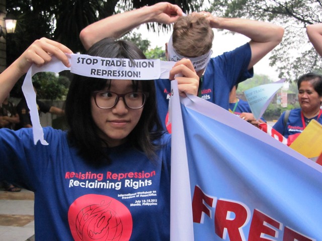 Hang Tung prepares to do 'solidarity walk' with other delegates to an international conference on freedom of association