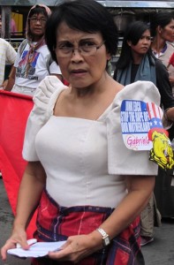 Gabriela Women Rep. Emmi de Jesus is angry that the marchers are prevented by the police from reaching the US Embassy. (Photo by M. Salamat / Bulatlat.com)