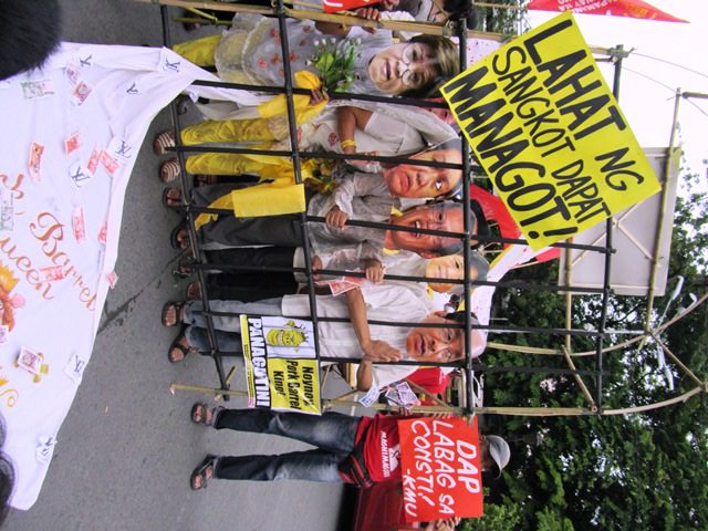 When overturned, the arch becomes their jail (Photo by M. Salamat / Bulatlat.com)