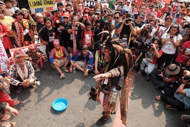 Lumad leaders perform the "panubadtubad" at the foot of Mendiola (Photo courtesy of Manila Today)