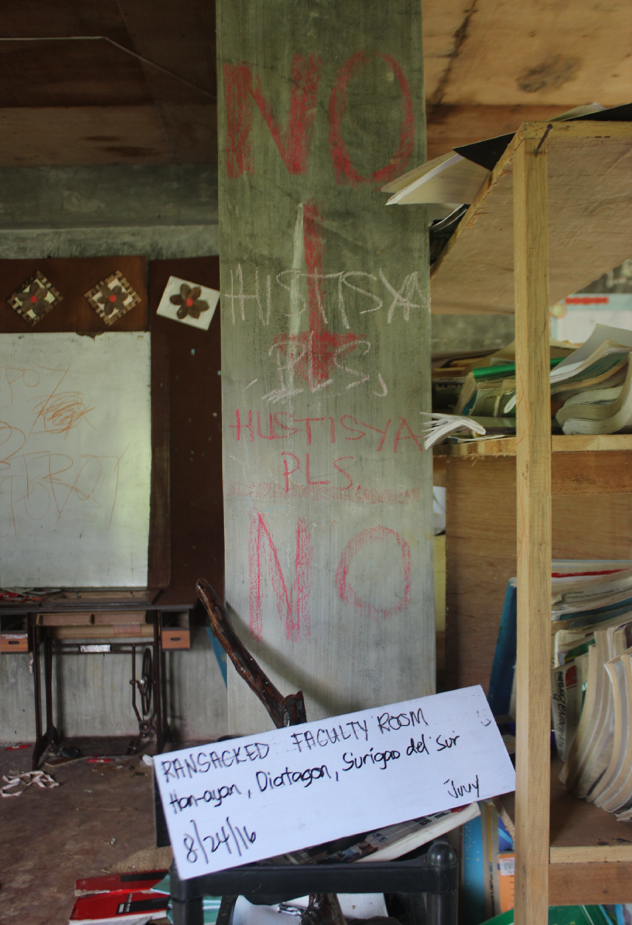 "NO HUSTISYA PLS." Writings in chalk inside the ransacked Alcadev faculty room (Contributed photo)