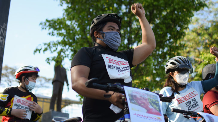 Activists hold bike ride in support of red-tagged Bayan officer, Dutch missionary